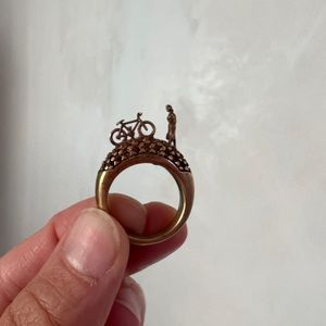 3-D bicycle with lady bronze ring, size 6.